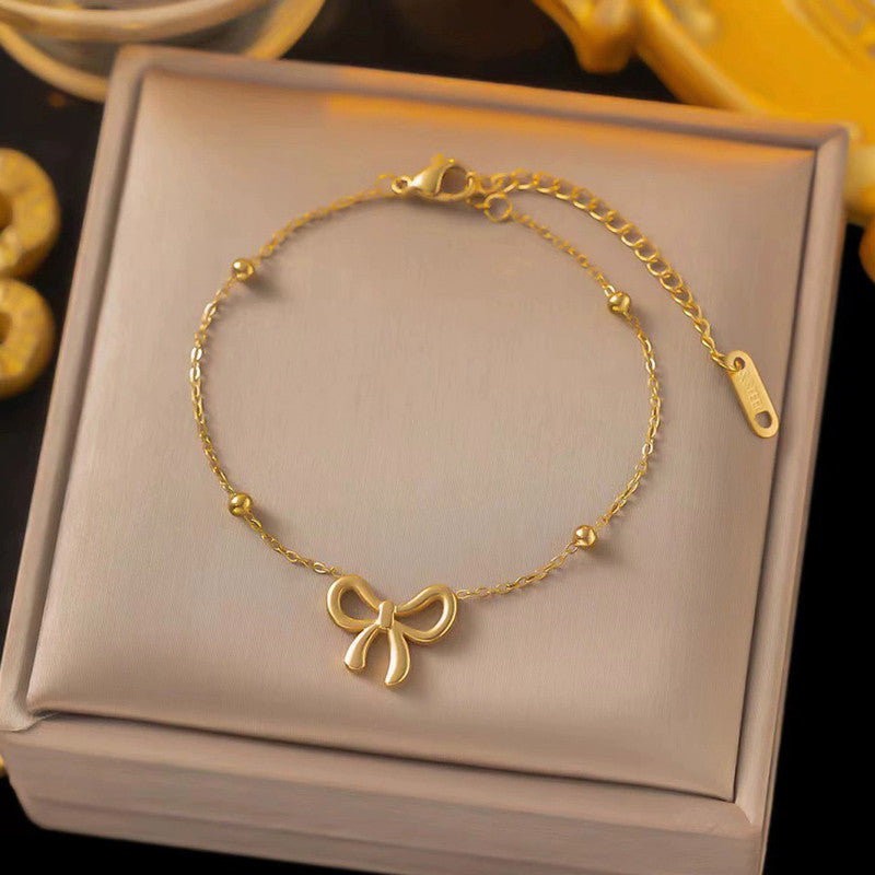 Gold Plated Infinite Bow Themed Jewellery set with chain,Earrings,Bracelet